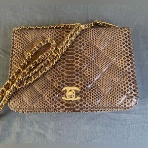 Never used Chanel snake skin leather and gold chain hand purse
